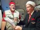 Pilots and passenger signing carols on the plane