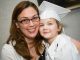 Graduating student posing with woman