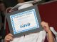 Student holding up diploma