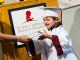 Graduating student accepting diploma