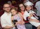 Graduating student posing with family