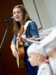 Child Life music therapist Amy Love performs a graduation song.