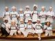 Kindergarten graduates take a group photo with their certificates.