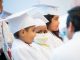 The children sit during the ceremony.