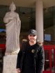 A man standing in front of the St. Jude Thaddeus statue