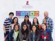 Students pose after the symposium in front of the Science Scholars step and repeat.