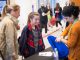 Students signing in for the Science Scholars symposium.