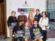 A group poses in front of the Science Scholars sign.