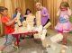 Patient siblings Brayden, Ashley, Mack and Jillian playing jenga
