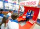 Kids playing ring toss.
