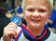 Robert Bragdon displays the recognition medals that each sibling received.