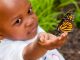 child holding up butterfly