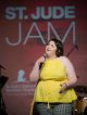 Teenage girl St. Jude patient singing on stage