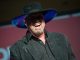 A member of Montgomery Gentry sings on stage.