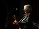 Mike Mills plays the guitar.