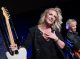 Clare Dunn smiles with her guitar after her performance.