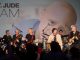All of the musicians gather to perform on stage.