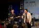 John Elefante and Mike Mills perform on stage together.