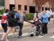 St. Jude patient high fives runners as they enter the St. Jude campus.