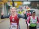 Woman running in the St. Jude marathon giving a thumbs up.