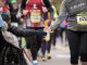 Runners high fiving a St. Jude patient.