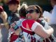 Runners hug each other after race.