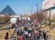 Runners race onto the St. Jude campus with the Bass Pro Shop pyramid in the background.