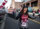 A 10k runner high-fives onlookers as she runs through the St. Jude campus.