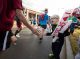 A St. Jude patient yells and high fives a participant.