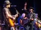 Big Kenny, John Rich, and Rodney Clawson performing on stage.
