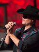 John Rich holding the microphone.