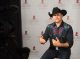 John Rich speaking in front of the St. Jude step and repeat