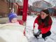 Child Life specialist Stephanie Lindblom builds a miniature snowman with Susan Faith Hicks.