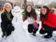Child Life specialists Ashley Wedderburn, Brittany O’Shea and Stephanie Lindblom create a snowman outside the Chili’s Care Center.