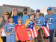 Group holding flags for Puerto Rico and China