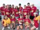 A large group of runners posing before the race