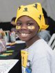 A girl smiling wearing a St. Jude bandana