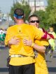 A runner hugging another runner.