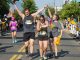 Two runners high fiving each other.