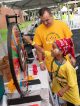 A child spins a wheel to win a prize in the kids corner.