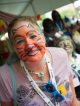 Survivor Cara participates in a face-painting activity during Survivors’ Day festivities.