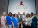 Several of the longest-living survivors visit with Downing.