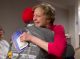 Debbie Crom and a St. Jude patient survivor hug.