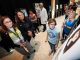 St. Jude patient, employee, Dr. Sara Frederico, and Dr. Raul Ribeiro view the Teen Art Gallery.