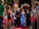 A teen couple walks the red carpet.