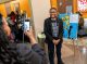 Teen standing with artwork
