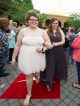 Two young ladies walking the red carpet.