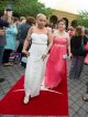 Two young women walking the red carpet.