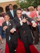 Two young men walking the red carpet.