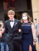 A young couple walking the red carpet.